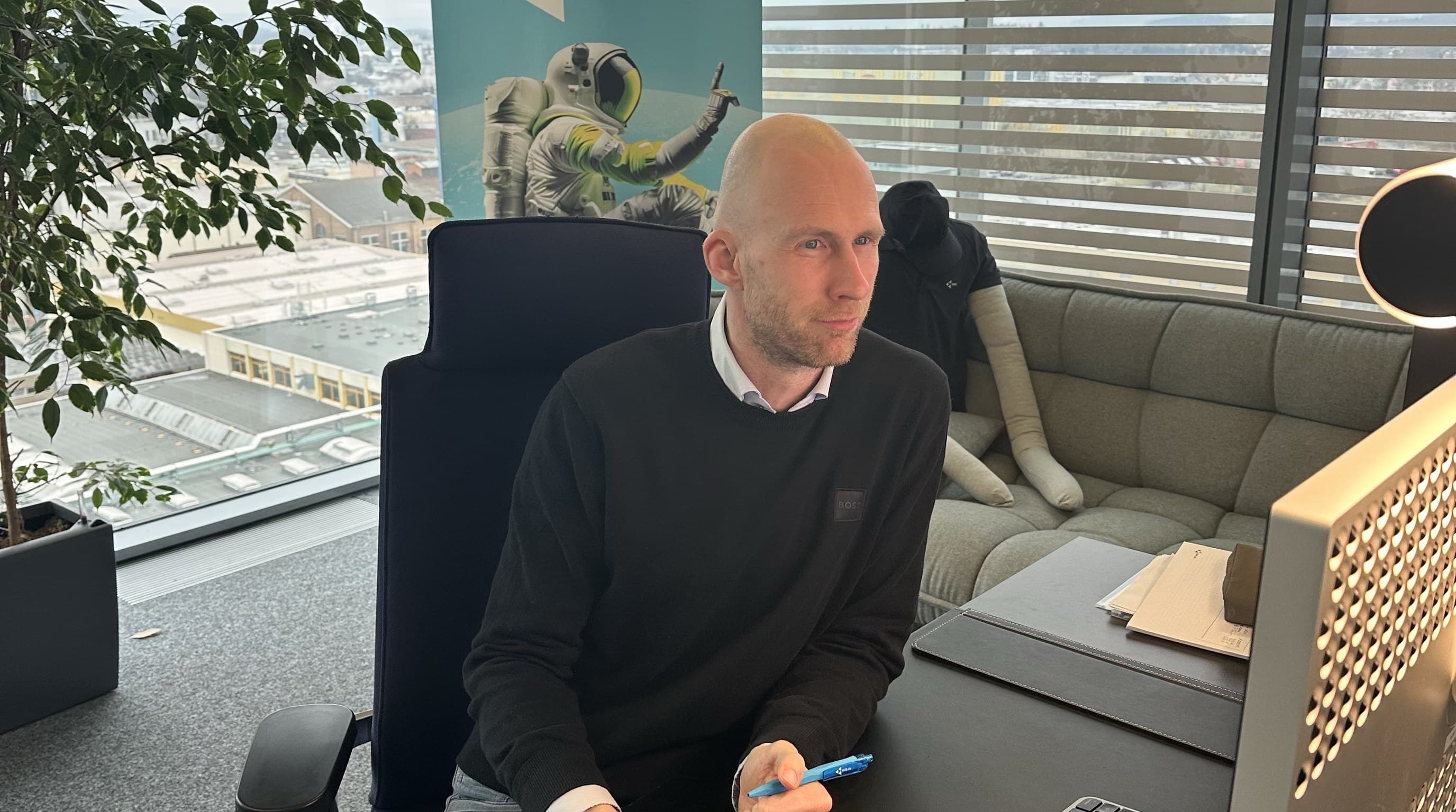 Jan Emmerich, managing director of NMS, at his desk in front of his screen